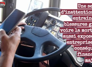 Un conducteur de camion distrait cause un accident et le jury accorde $31 millions à la victime Photo d’un conducteur de camion qui texte avec son cellulaire au volant, représentant les conséquences graves de la distraction au volant pour les camionneurs et les entreprises de transport.