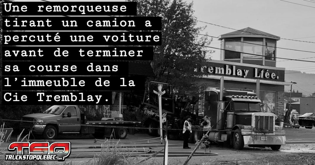 Photo montrant l’intervention d’urgence à Baie-Saint-Paul, avec une remorqueuse encastrée dans un immeuble suite à une collision violente.