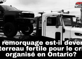 Hamilton déclare la guerre au remorquage illégal et aux tactiques d’intimidation Photo d’un camion de remorquage stationné sur une route en Ontario, illustrant les enjeux de remorquage illégal dans la province.