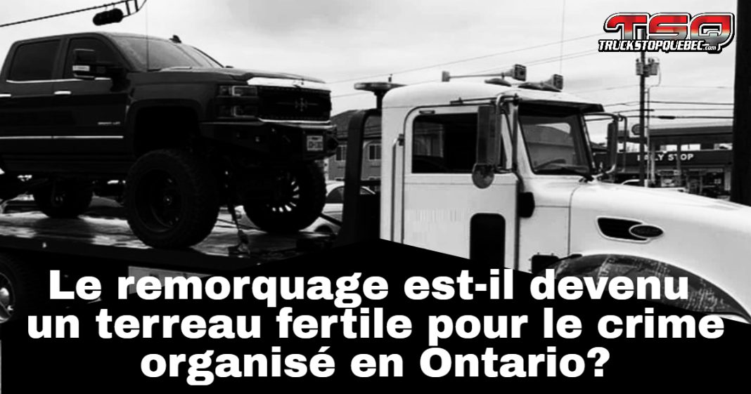 Photo d’un camion de remorquage stationné sur une route en Ontario, illustrant les enjeux de remorquage illégal dans la province.