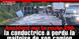 Accident impliquant un camion lourd sur la route 299 en Gaspésie Camion semi-remorque renversé sur la route 299 en Gaspésie, bloquant complètement la circulation; équipes de remorquage et véhicules en attente sur place.