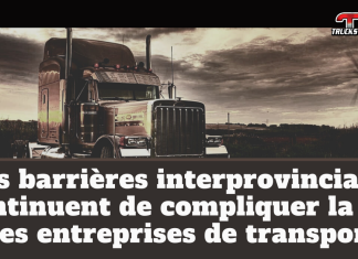Les barrières interprovinciales continuent de compliquer la vie des entreprises de transport Camion lourd circulant en zone rurale avec des éoliennes en arrière-plan, image illustrant le texte Les barrières interprovinciales continuent de compliquer la vie des entreprises de transport