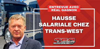 Hausse salariale : Trans-West pose un geste fort pour ses routiers Réal Gagnon et camions de Trans-West au terminal de Lachine. Texte sur l'image : Hausse salariale chez Trans-West.