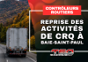 Les contrôleurs routiers reprennent leurs activités à Baie-Saint-Paul Camion lourd circulant sur la route 138 dans Charlevoix, avec un visuel annonçant la reprise des activités des contrôleurs routiers à Baie-Saint-Paul.